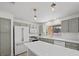 Bright kitchen boasts modern appliances, custom cabinets, large island, and stylish pendant lighting at 2216 Spring Water Dr, Las Vegas, NV 89134