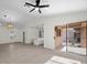 Bright living room features wood-look floors, high ceilings, modern lighting, and sliding door access at 2216 Spring Water Dr, Las Vegas, NV 89134