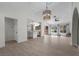 Bright living room features wood-look floors, high ceilings, modern lighting, and an open floorplan at 2216 Spring Water Dr, Las Vegas, NV 89134