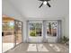Bright living room features wood-look floors, high ceilings, modern lighting, and abundant natural light at 2216 Spring Water Dr, Las Vegas, NV 89134