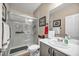 This bathroom features a marble shower with glass doors, gray vanity and plenty of counter space at 2621 Icy Moon St, Henderson, NV 89044