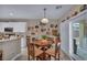 Cozy breakfast nook features a round table with seating for four and a sliding door to the patio at 2621 Icy Moon St, Henderson, NV 89044