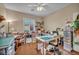 This is a craft room with work surfaces, organized shelves, sewing machine, and a bright window at 2621 Icy Moon St, Henderson, NV 89044