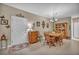 This dining room features wood floors, a chandelier, wood furniture, and decorative butterflies at 2621 Icy Moon St, Henderson, NV 89044