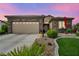 Charming home with a stone facade, well-manicured lawn, and a two-car garage at 2621 Icy Moon St, Henderson, NV 89044