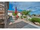 Landscaped front yard with a stone pathway, seating area, and vibrant plants at 2621 Icy Moon St, Henderson, NV 89044