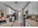 Bright kitchen featuring stainless steel appliances, light countertops, and white cabinets at 2621 Icy Moon St, Henderson, NV 89044