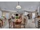 Open-concept living space with a kitchen, dining area and living room featuring recessed lighting at 2621 Icy Moon St, Henderson, NV 89044