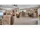 Open-concept living space featuring bar stool seating, a cozy living room and dining table at 2621 Icy Moon St, Henderson, NV 89044