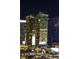 Exterior view of the luxury condo building with unique architectural design and nearby stores at 3722 S Las Vegas Blvd # 503, Las Vegas, NV 89158