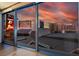Expansive city view through large window showcases Aria, Hollywood, and Polo Towers set against a vibrant sunset at 3722 S Las Vegas Blvd # 503, Las Vegas, NV 89158
