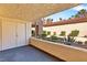 Outdoor balcony with double door access, plants, and view of other buildings at 3827 Desert Marina Dr # 211, Laughlin, NV 89029