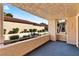 Outdoor balcony featuring low fence, plants, and view of other buildings at 3827 Desert Marina Dr # 211, Laughlin, NV 89029