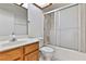 Bathroom featuring wood vanity, toilet, and tiled shower with sliding glass doors at 3827 Desert Marina Dr # 211, Laughlin, NV 89029