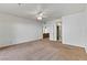 Bright bedroom featuring neutral carpet, ceiling fan, and a closet at 3827 Desert Marina Dr # 211, Laughlin, NV 89029