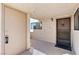 Outdoor entryway with secure door, window, and covered walkway that leads into the residence at 3827 Desert Marina Dr # 211, Laughlin, NV 89029