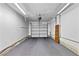 Spacious garage featuring carpet and an automatic garage door opener at 3827 Desert Marina Dr # 211, Laughlin, NV 89029