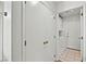 Hallway featuring carpeted floors, a storage closet, and entry to the laundry room at 3827 Desert Marina Dr # 211, Laughlin, NV 89029