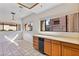 Well-lit kitchen boasts ample counter space, oak cabinets, and tile floors at 3827 Desert Marina Dr # 211, Laughlin, NV 89029