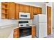 Updated kitchen with modern appliances, oak cabinets, and tile flooring at 3827 Desert Marina Dr # 211, Laughlin, NV 89029