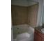 Clean bathroom featuring tiled shower/tub combination and granite countertops for a modern touch at 4050 Pacific Harbors Dr # 149, Las Vegas, NV 89121