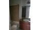 Bathroom featuring tiled shower/tub, granite countertops, and ample storage space for everyday essentials at 4050 Pacific Harbors Dr # 149, Las Vegas, NV 89121