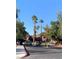 Gated property entrance with a view of well-maintained grounds and trees at 4050 Pacific Harbors Dr # 149, Las Vegas, NV 89121