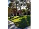 Condominium grounds with grass and mature trees at 4050 Pacific Harbors Dr # 149, Las Vegas, NV 89121