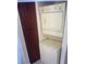Stacked washer and dryer in laundry room with an adjacent storage cabinet at 4050 Pacific Harbors Dr # 149, Las Vegas, NV 89121