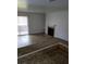 Bright living room featuring modern flooring, a cozy fireplace, and access to a private outdoor space at 4050 Pacific Harbors Dr # 149, Las Vegas, NV 89121