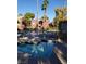 A tranquil community pool and spa surrounded by lush greenery for relaxation and enjoyment at 4050 Pacific Harbors Dr # 149, Las Vegas, NV 89121
