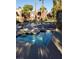 Community pool and lounge area with beautiful landscaping offers a relaxing retreat at 4050 Pacific Harbors Dr # 149, Las Vegas, NV 89121