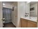 This bathroom features a sink, vanity, and shower at 4609 Hearts Desire Ave, Las Vegas, NV 89115
