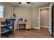 This bedroom has a desk and hardwood floor at 4609 Hearts Desire Ave, Las Vegas, NV 89115