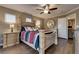 Bedroom with a full size bed, ceiling fan, and two side tables with drawers at 4609 Hearts Desire Ave, Las Vegas, NV 89115