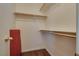 This closet features hardwood floor and wooden racks at 4609 Hearts Desire Ave, Las Vegas, NV 89115