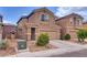 Charming two-story home with a two-car garage and desert landscaping at 4609 Hearts Desire Ave, Las Vegas, NV 89115