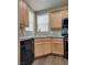 Kitchen featuring stone countertops, wood cabinets and black appliances at 4609 Hearts Desire Ave, Las Vegas, NV 89115