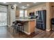 Kitchen with breakfast bar, stainless steel appliances, and ample counter space at 4609 Hearts Desire Ave, Las Vegas, NV 89115