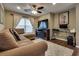 Comfortable living room featuring a plush sectional sofa, fireplace, and TV console at 4609 Hearts Desire Ave, Las Vegas, NV 89115