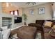 Inviting living room with entertainment center, comfortable sofa, and large ottoman at 4609 Hearts Desire Ave, Las Vegas, NV 89115
