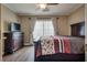 Cozy main bedroom with a queen-sized bed, dresser and hardwood floor at 4609 Hearts Desire Ave, Las Vegas, NV 89115