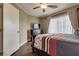 This bedroom has a queen-sized bed, dresser, and hardwood floor at 4609 Hearts Desire Ave, Las Vegas, NV 89115