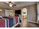 Bedroom with wood floors and an arched hallway to the bathroom at 4609 Hearts Desire Ave, Las Vegas, NV 89115