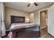 This bedroom features a king-sized bed, hardwood floor, and natural light at 4609 Hearts Desire Ave, Las Vegas, NV 89115