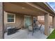 Relaxing covered patio with a grill, ideal for summer barbecues at 4609 Hearts Desire Ave, Las Vegas, NV 89115