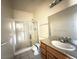 Bathroom featuring a glass enclosed shower, sink with granite countertop and modern fixtures at 4831 W Bell Vista Ave, Pahrump, NV 89060
