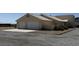 Image of the exterior of a single-story home with a two-car garage and desert landscaping at 4831 W Bell Vista Ave, Pahrump, NV 89060
