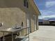 Exterior view featuring a stainless steel outdoor sink and two convenient exterior doors at 4831 W Bell Vista Ave, Pahrump, NV 89060