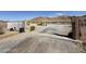 View of a gate to the property with mountain views in the distance at 4831 W Bell Vista Ave, Pahrump, NV 89060